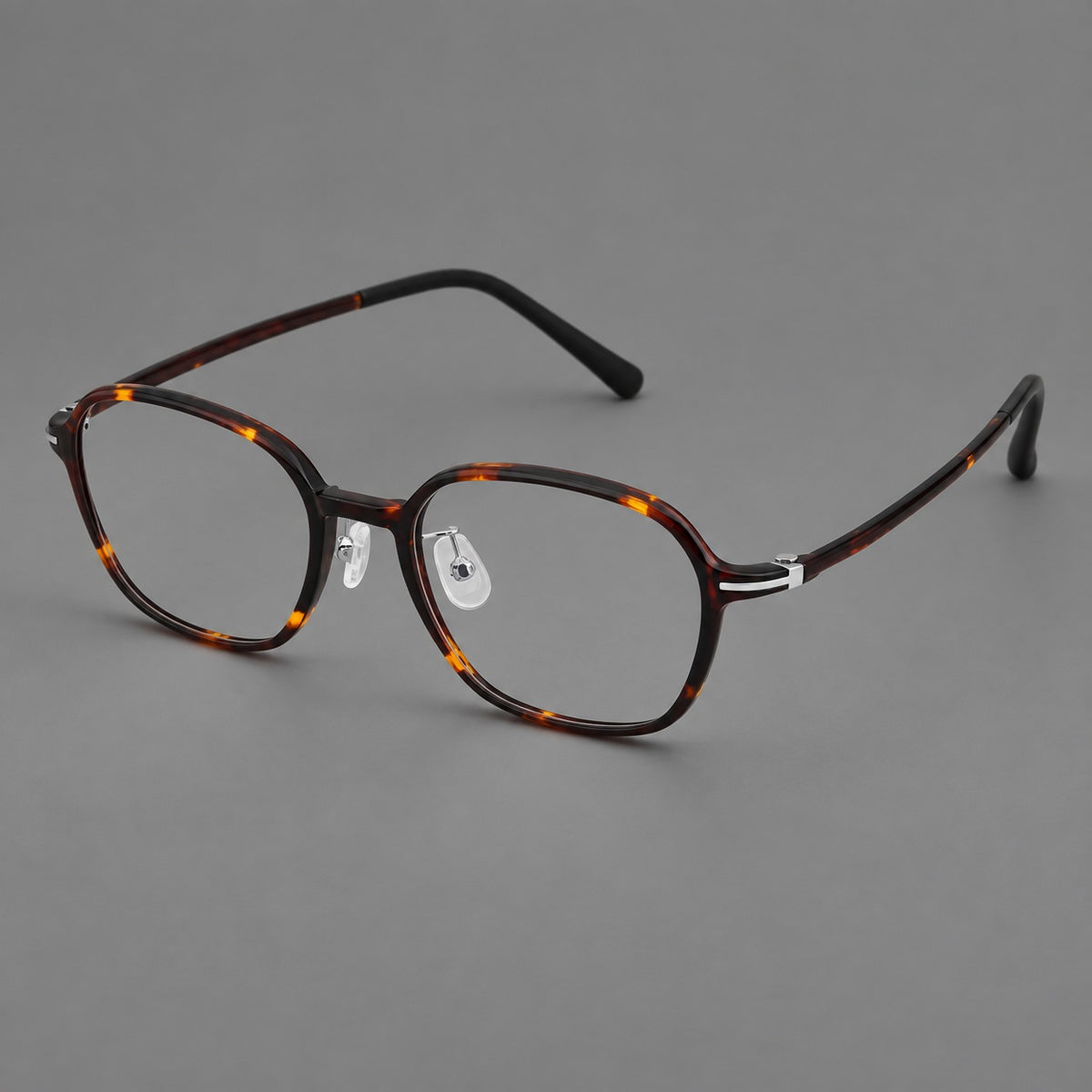 Rounded geometric plastic eyeglasses with softly angled rims and a curved bridge in Tortoiseshell, three quarter view