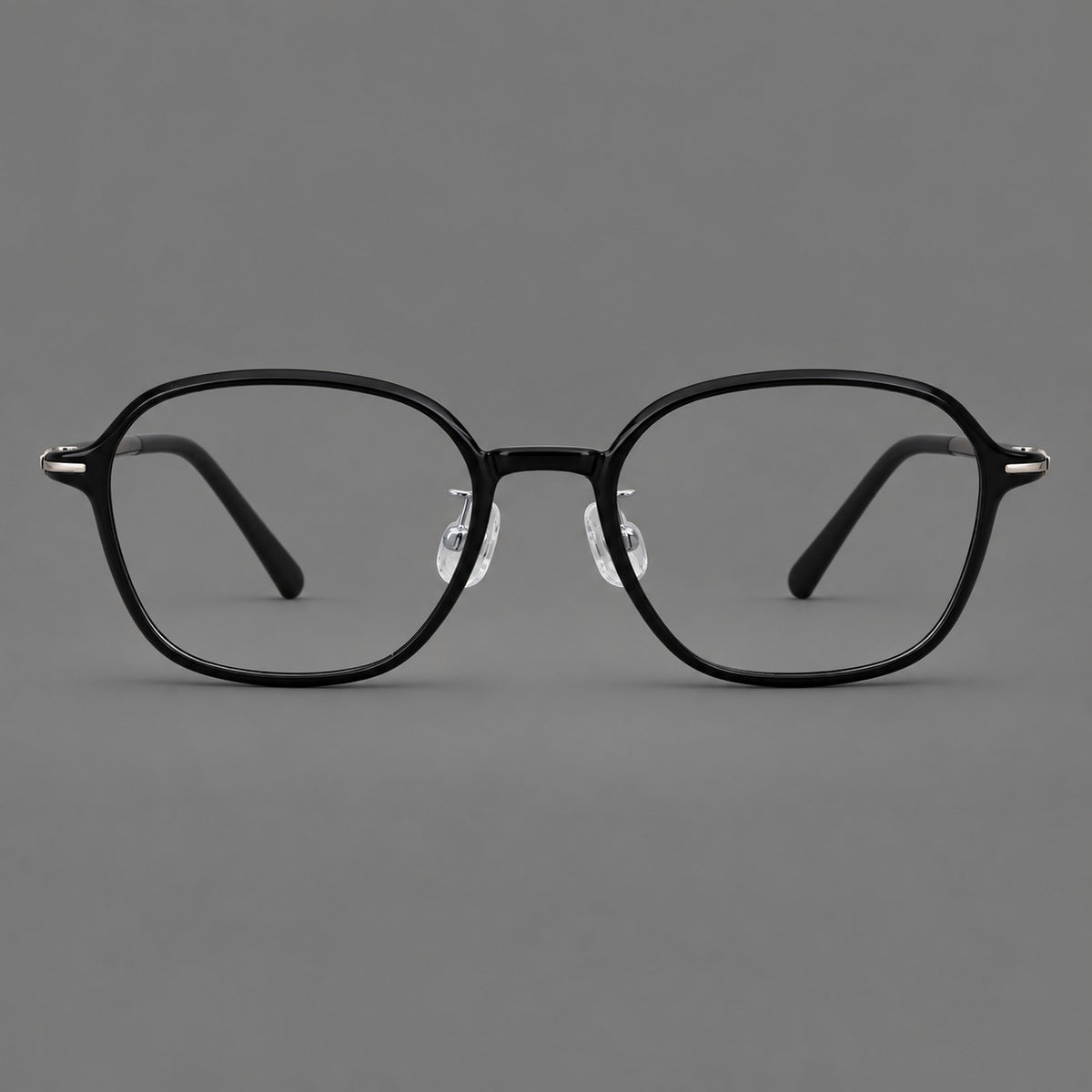 Rounded geometric plastic eyeglasses with softly angled rims and a curved bridge in Glossy Black, front view