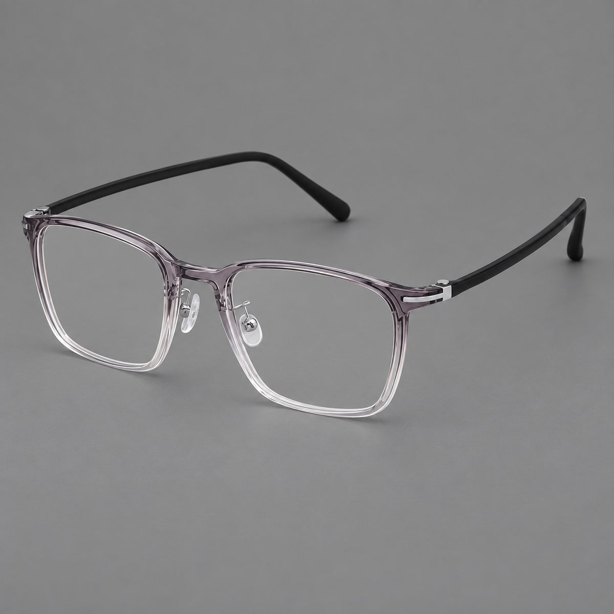 Modern square plastic eyeglasses with a smooth browline and slim metal corner details in Ink Grey Gradient, three quarter view