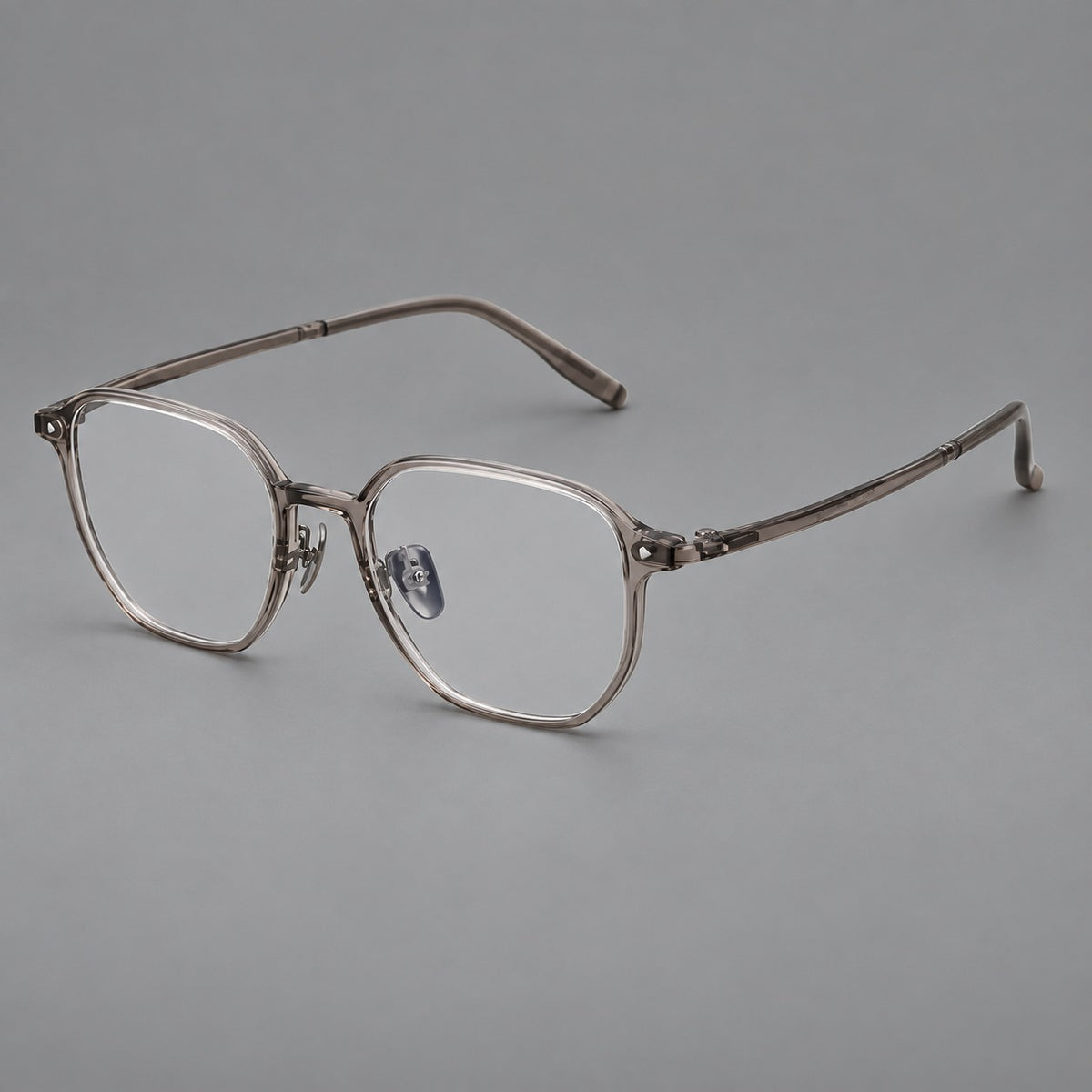 Soft square plastic eyeglasses with rounded lower rims and a broad curved bridge in Grey Brown, three quarter view