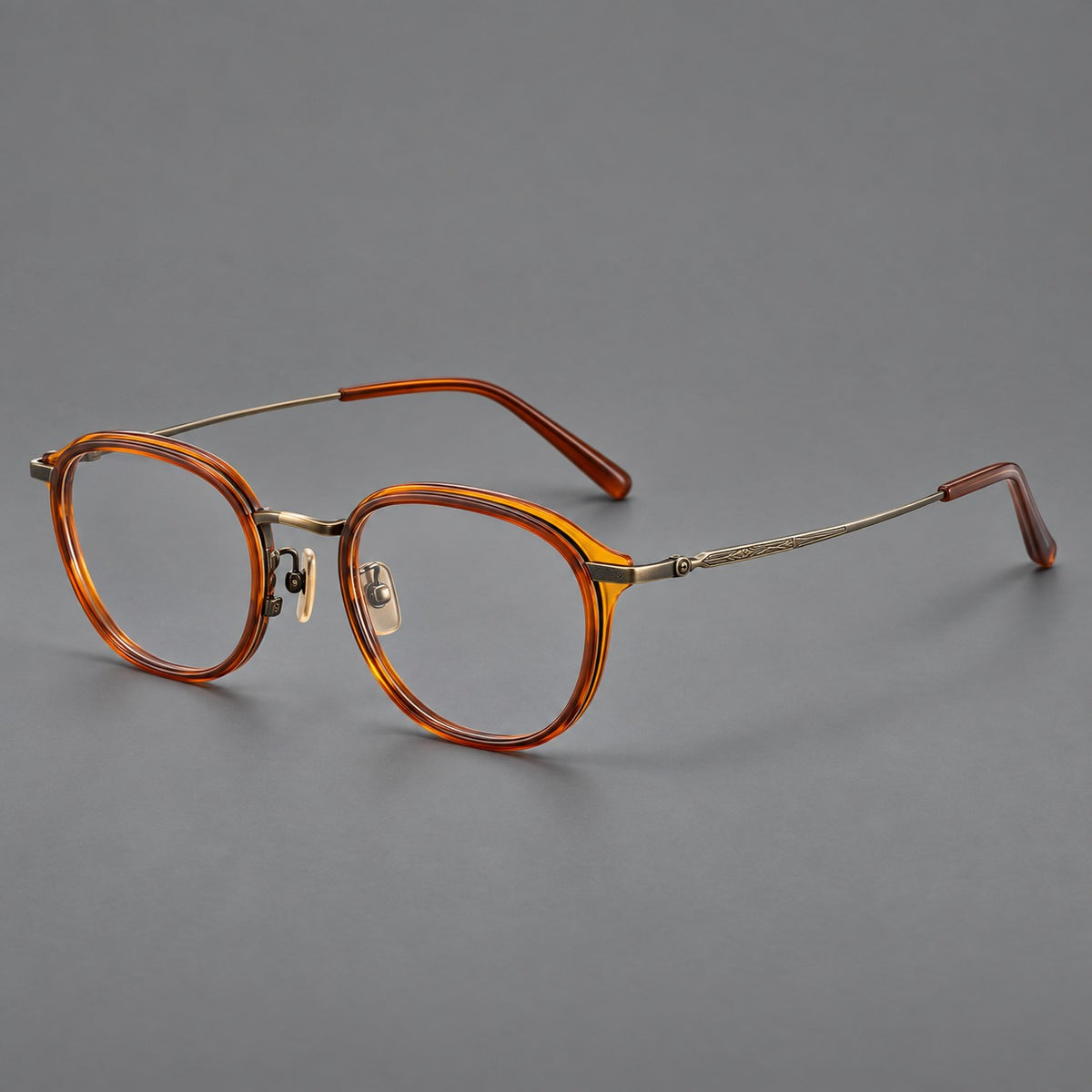 Soft square eyeglasses in acetate and titanium with rounded corners and decorative metal temples in Brown Tortoiseshell / Antique Gold, three quarter view