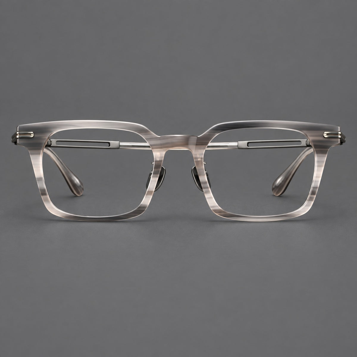 Modern acetate and titanium eyeglasses with angular square rims and curved metal hinges in Striped Grey / Brushed Grey, front view