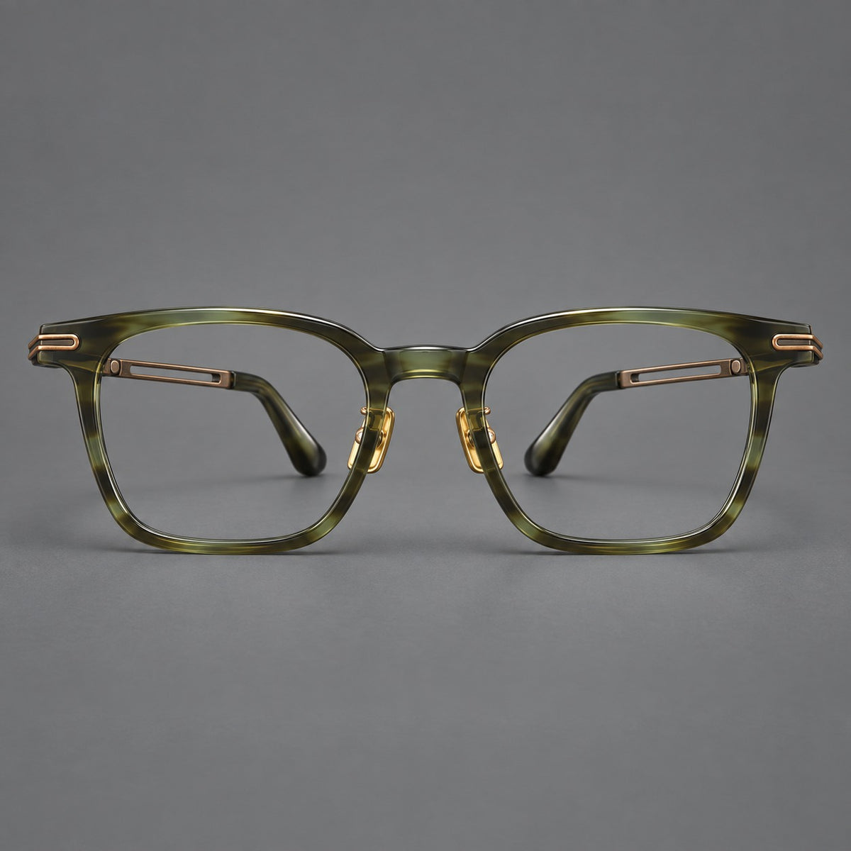 Acetate and titanium eyeglasses with rounded rectangular rims and sculpted open loop joints in Clear Olive Green / Antique Bronze, front view