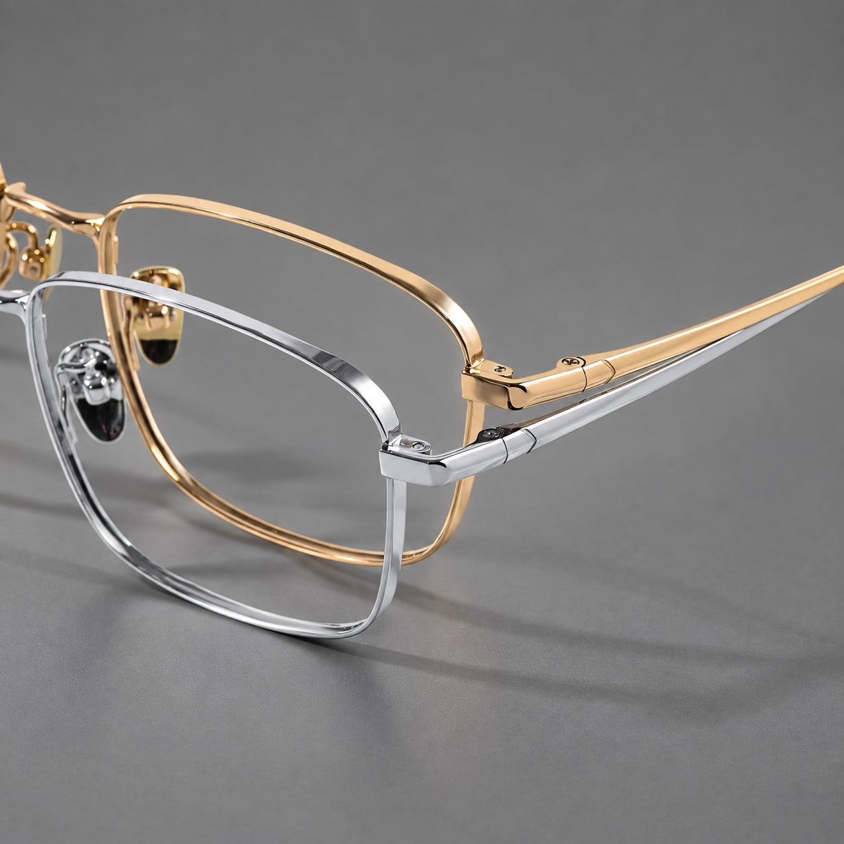 Modern square titanium glasses with an angular bridge and broad straight temples, frame details