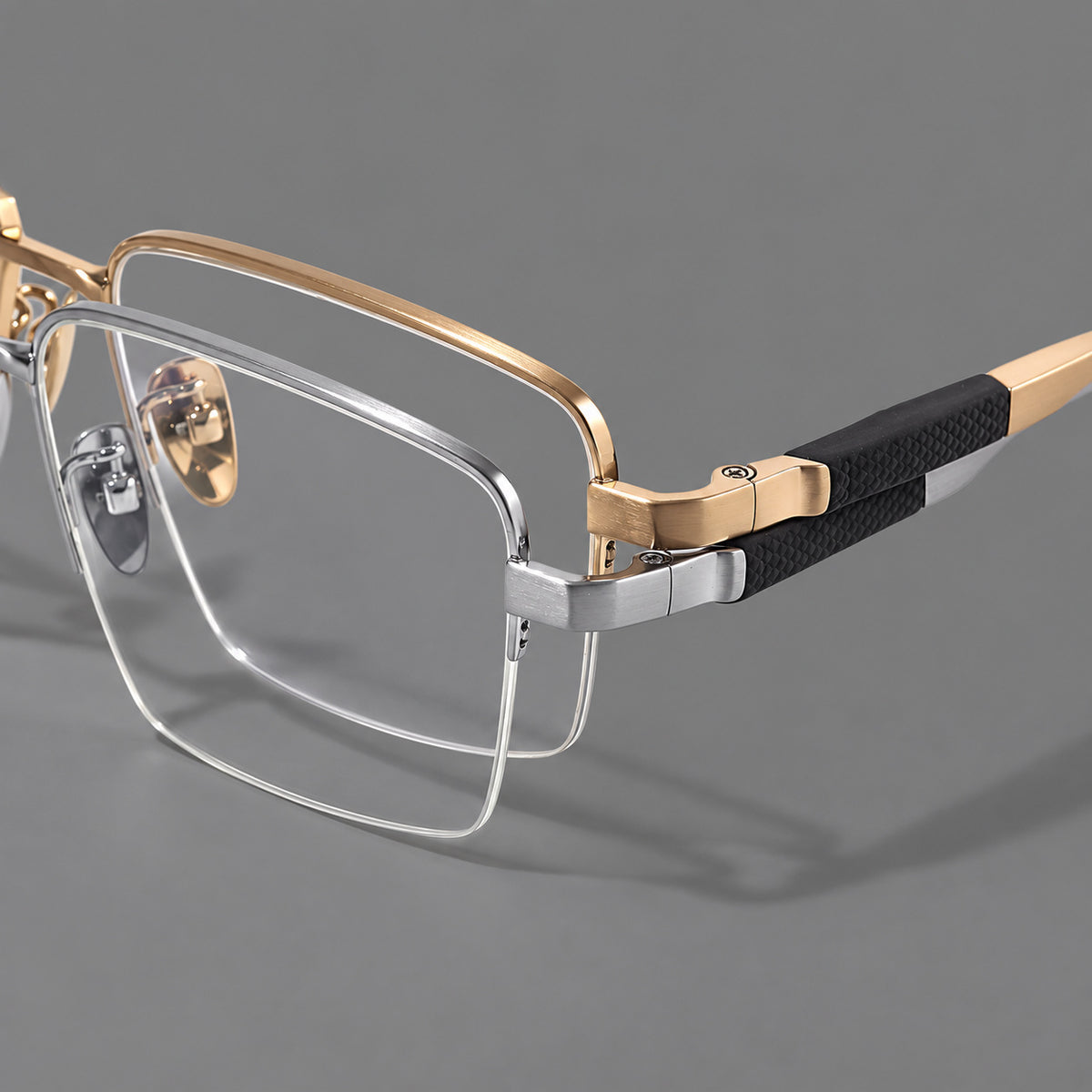 Wide half frame titanium glasses with rectangular lenses and textured temples, frame details