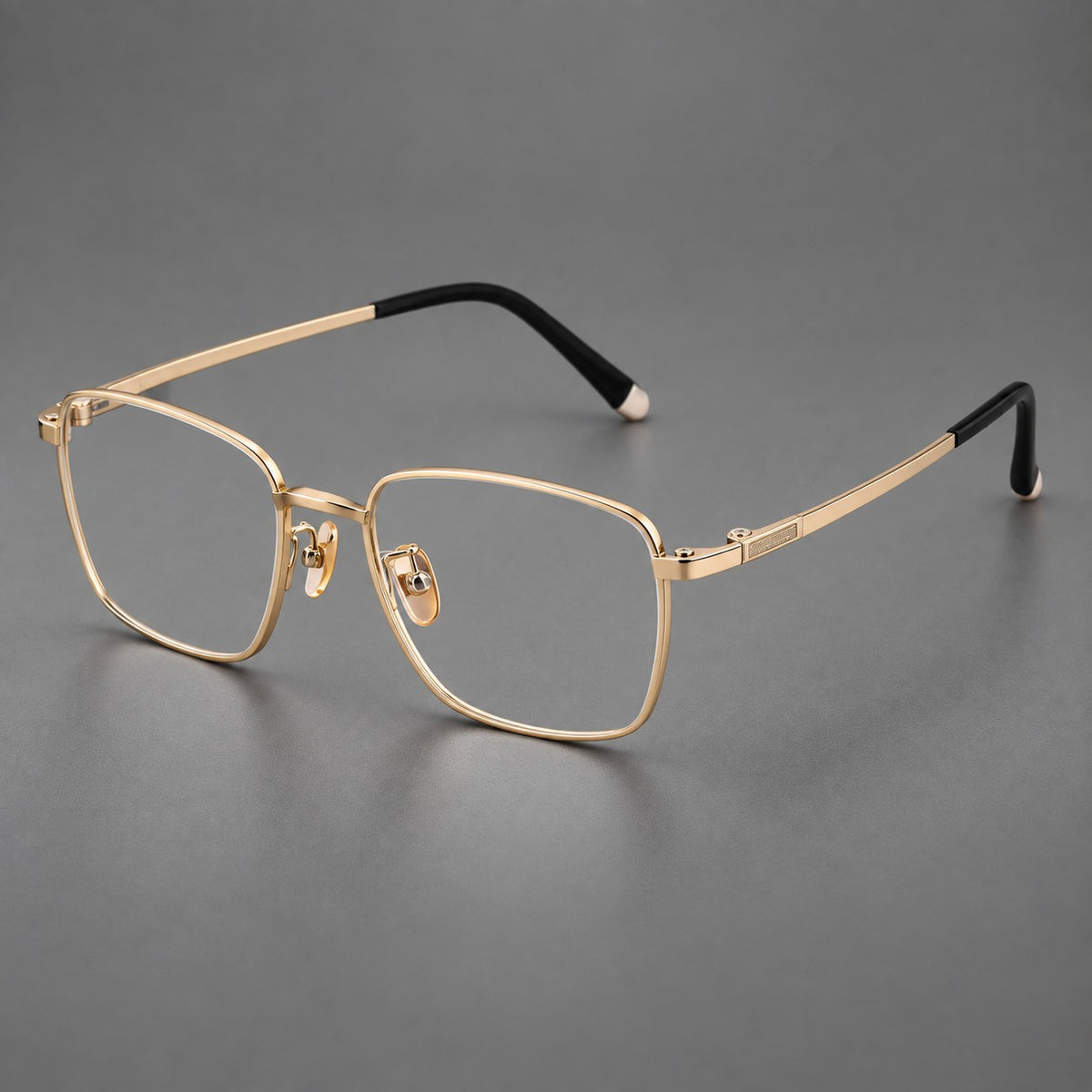 Clean rectangular titanium glasses with inset temple details and pale end accents in Gold, three quarter view