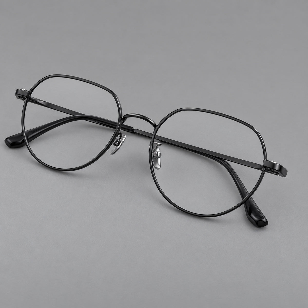 Classic panto titanium glasses with a curved bridge and slim straight temples in Black, three quarter view