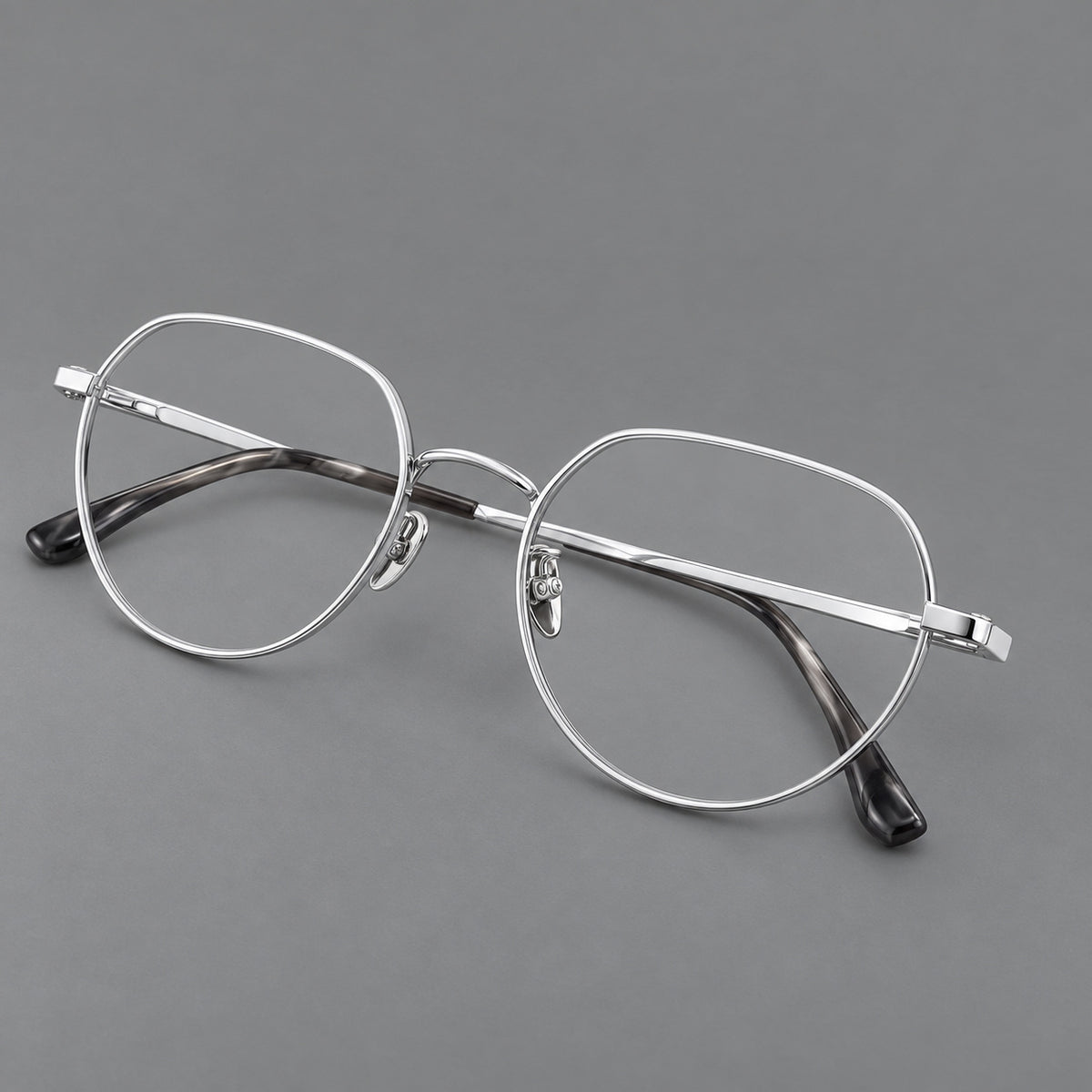 Classic panto titanium glasses with a curved bridge and slim straight temples in Silver, three quarter view