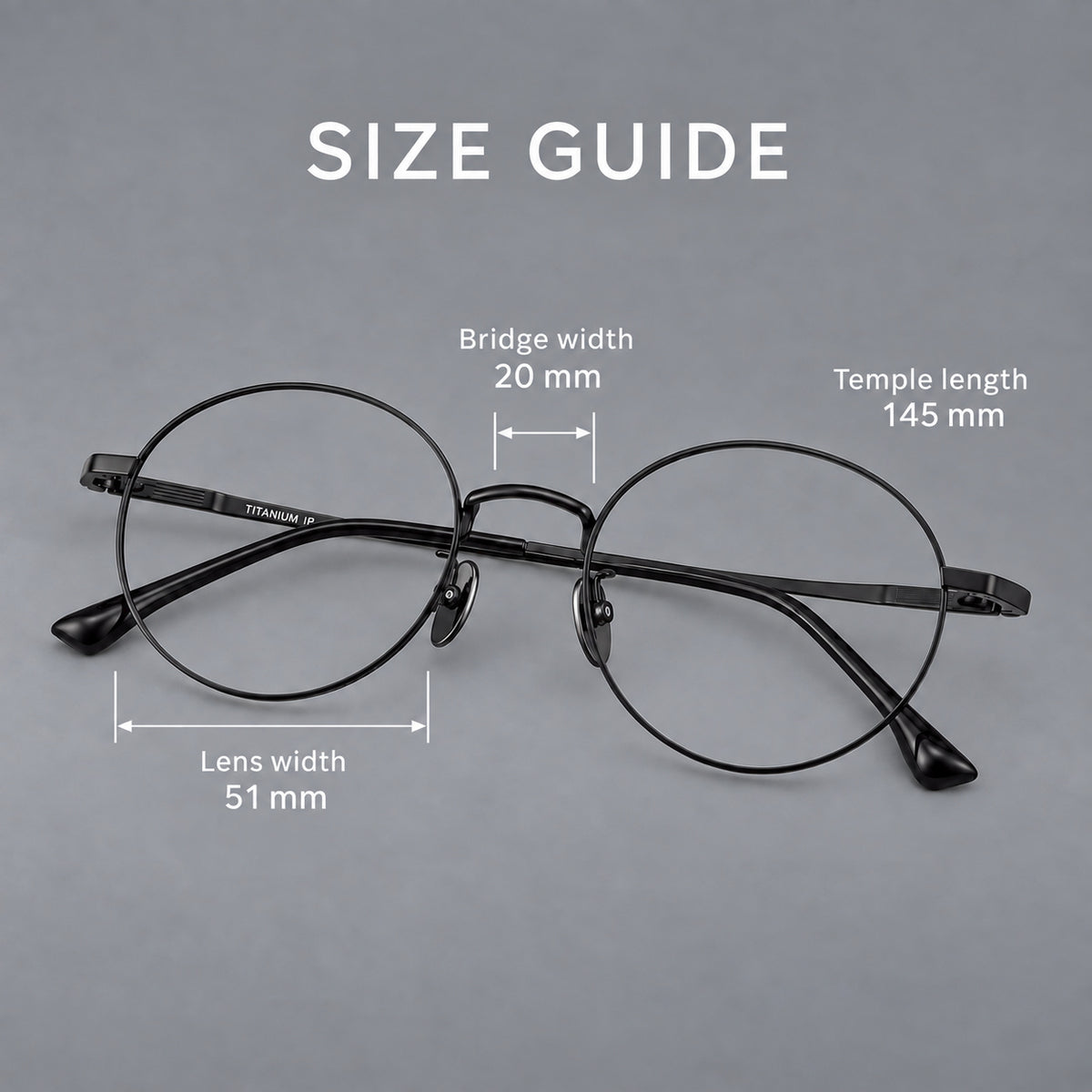 Classic circular titanium glasses with a raised bridge and lined temple accents, size guide in millimetres