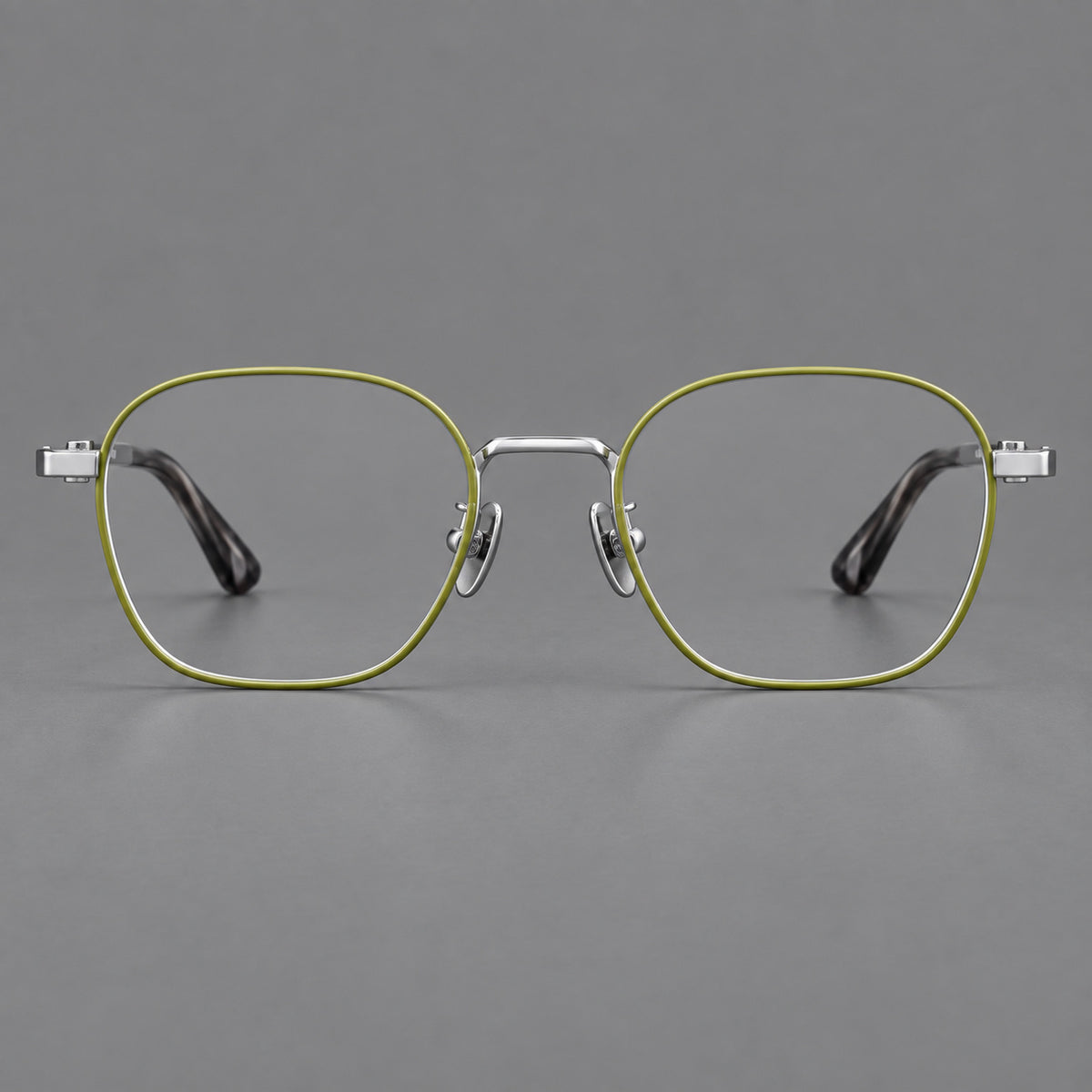 Rounded panto titanium glasses with an angular bridge and broad flat temples in Green and Silver, front view