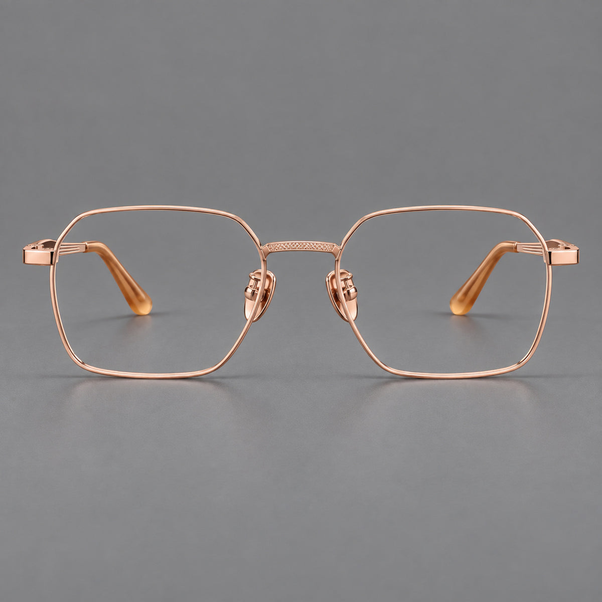 Geometric square titanium glasses with a textured bridge and fine temple grooves in Rose Gold, front view