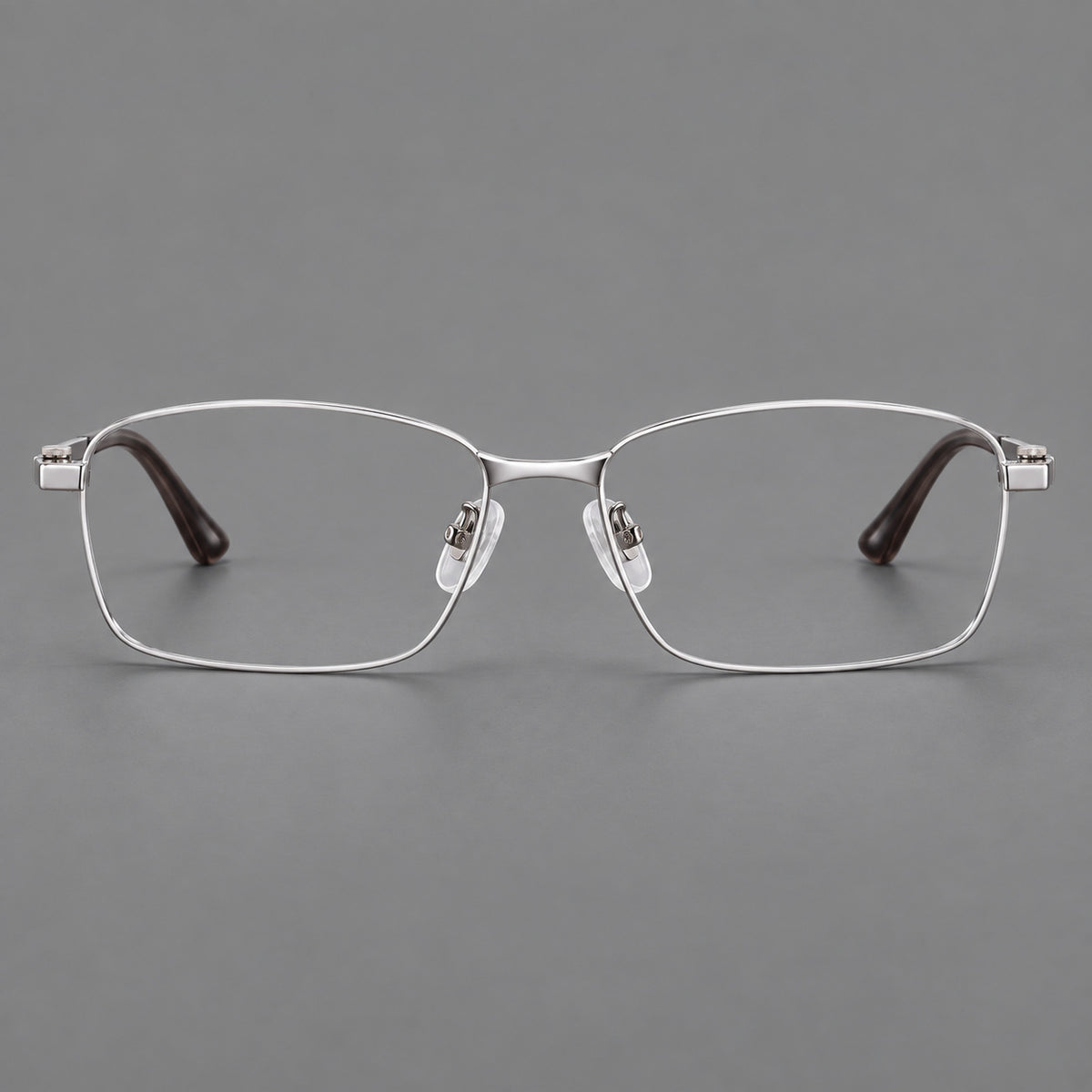 Wide rectangular titanium glasses with a broad bridge and rounded hinge caps in Silver, front view