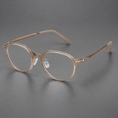 Retro round plastic eyeglasses with a curved bridge and slim metal corner accents in Tea, three quarter view lens detail