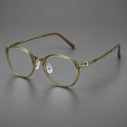Compact round plastic eyeglasses with gently lifted corners and clear nose pads in Iced Green Tea, three quarter view additional product view