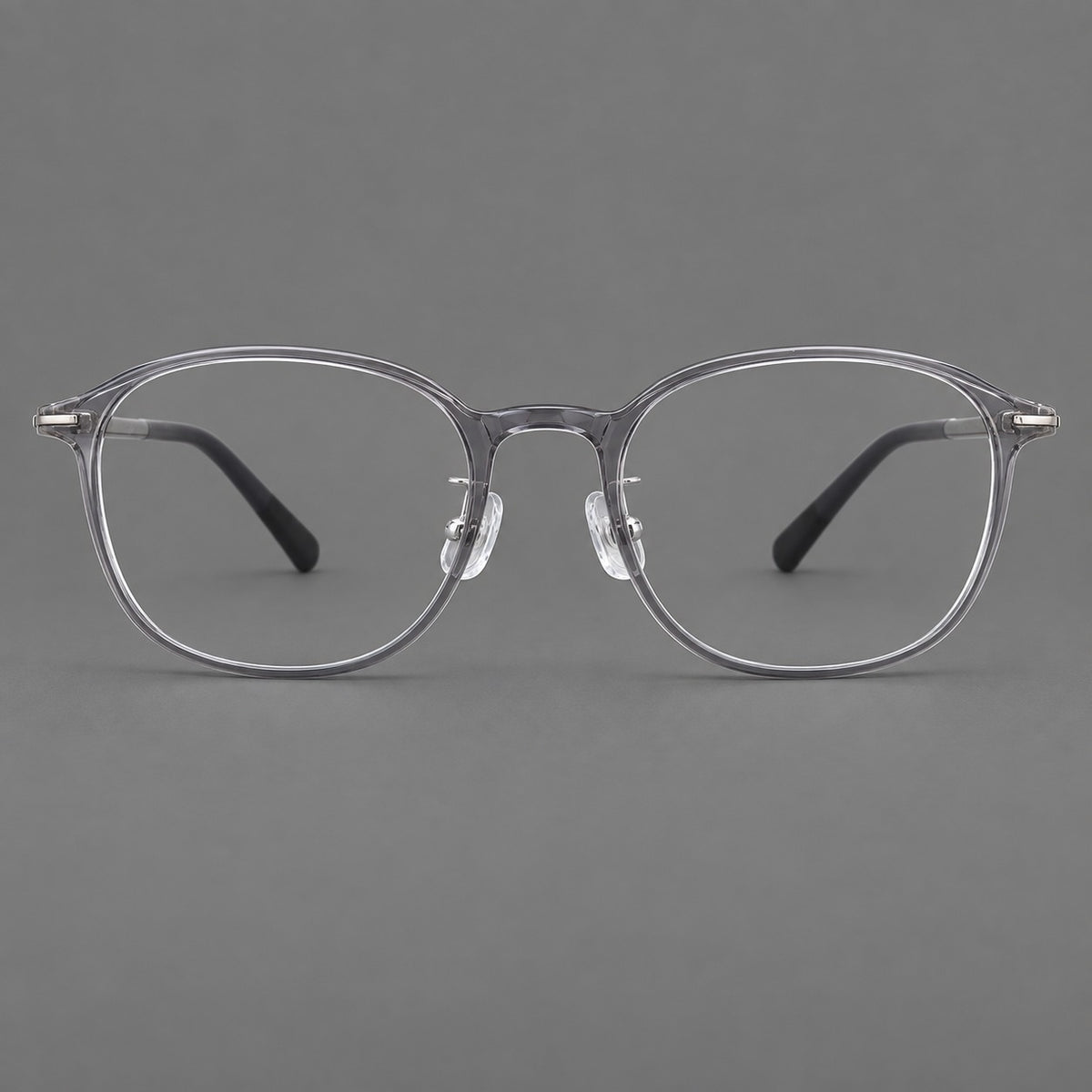 Soft square plastic eyeglasses with a raised browline and rounded lower corners in Clear Grey, front view