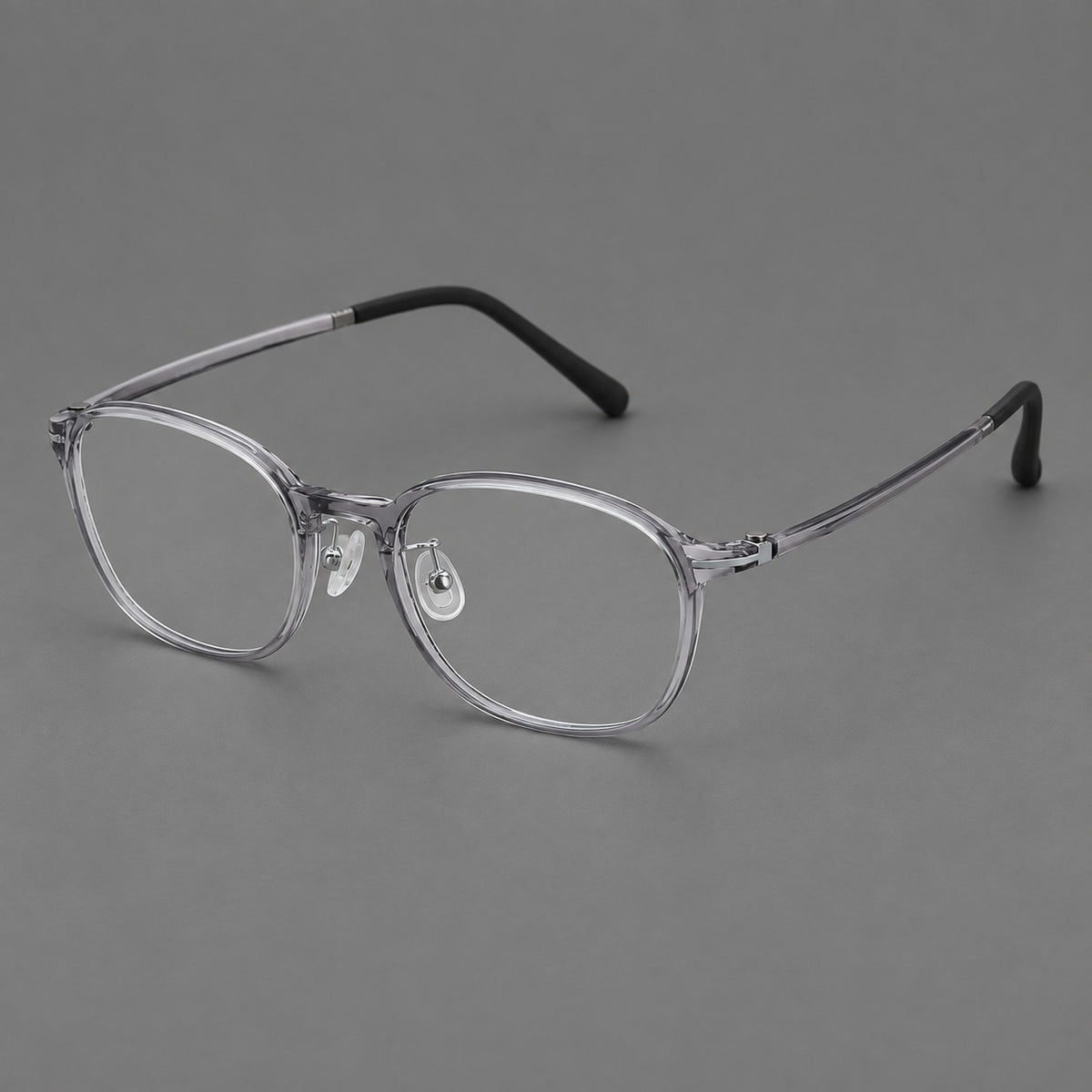 Soft square plastic eyeglasses with a raised browline and rounded lower corners in Clear Grey, three quarter view