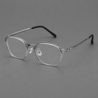 Soft square plastic eyeglasses with a raised browline and rounded lower corners in Clear Grey, three quarter view front view
