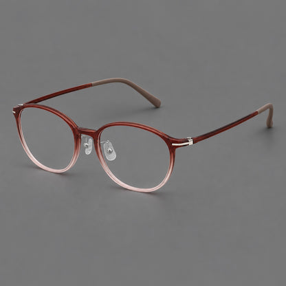 Slim oval plastic eyeglasses with a low profile and subtle metal corner accents in Red Brown Gradient, three quarter view lens detail