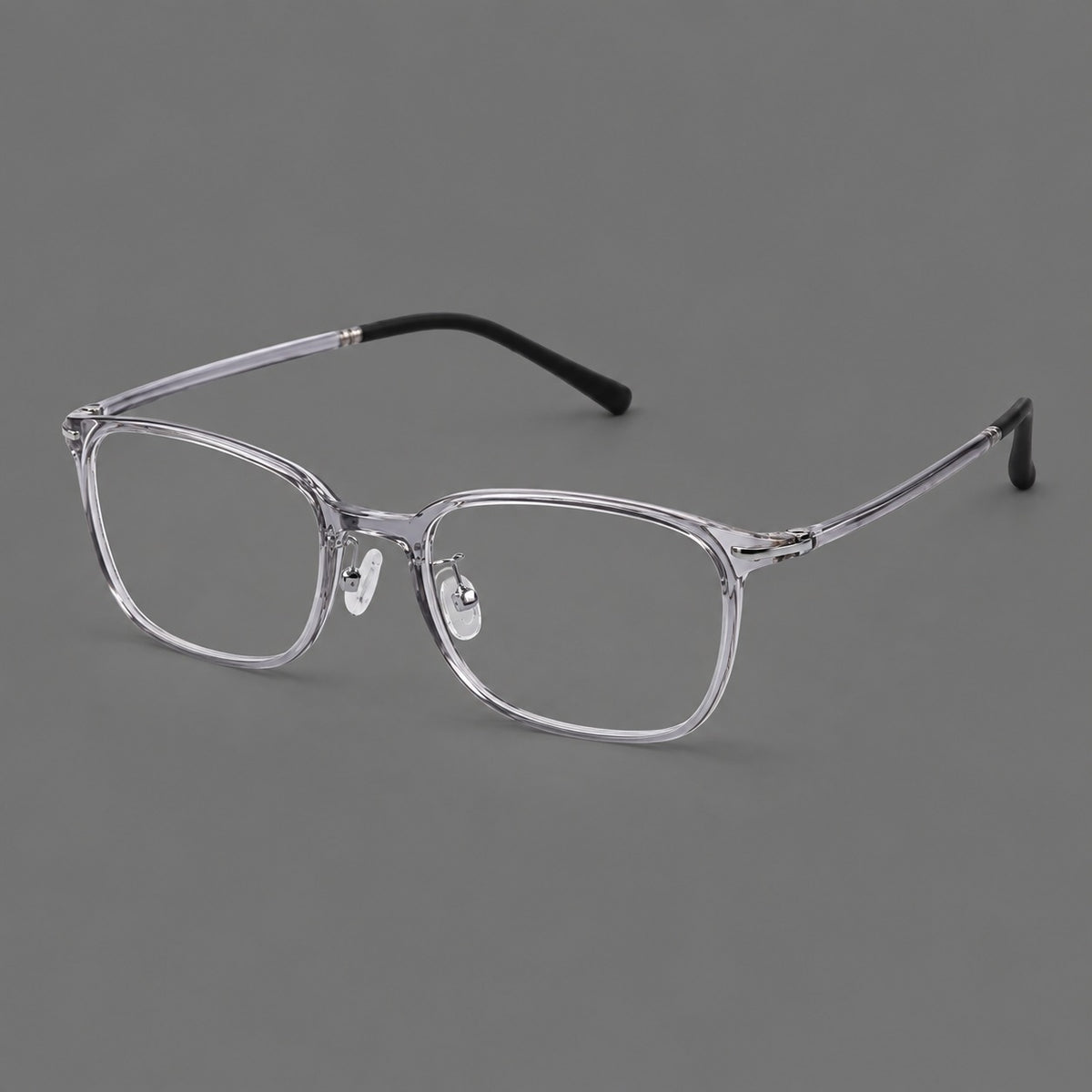 Classic square plastic eyeglasses with broad lenses and softly rounded edges in Clear Grey, three quarter view