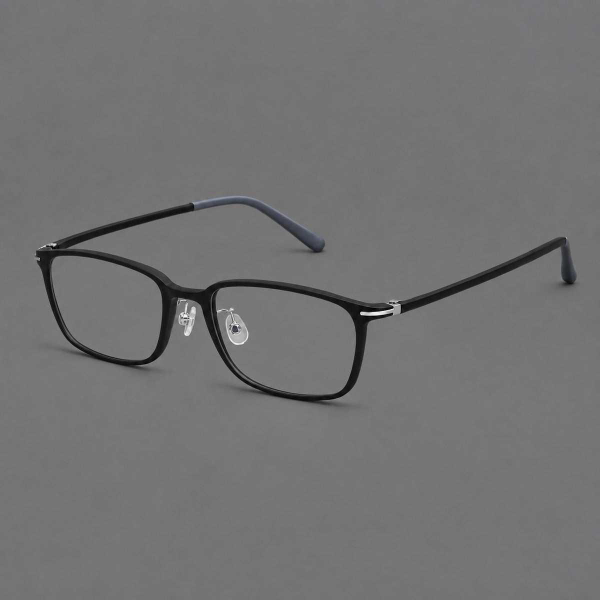 Low profile rectangular plastic eyeglasses with a straight browline and slim temples in Matte Black, three quarter view