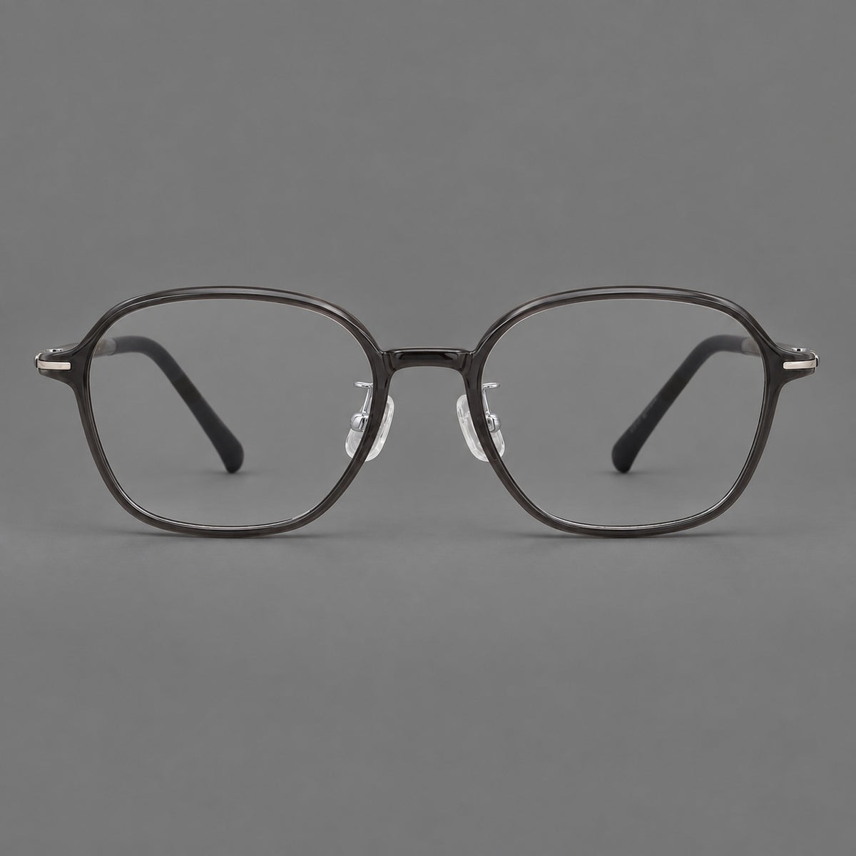 Rounded geometric plastic eyeglasses with softly angled rims and a curved bridge in Dark Grey, front view