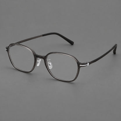 Rounded geometric plastic eyeglasses with softly angled rims and a curved bridge in Dark Grey, three quarter view front view