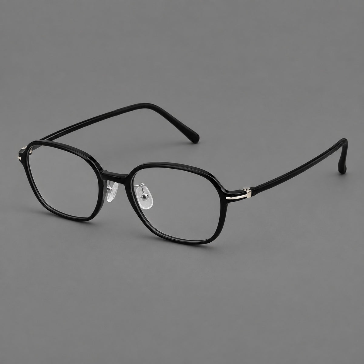 Rounded geometric plastic eyeglasses with softly angled rims and a curved bridge in Glossy Black, three quarter view