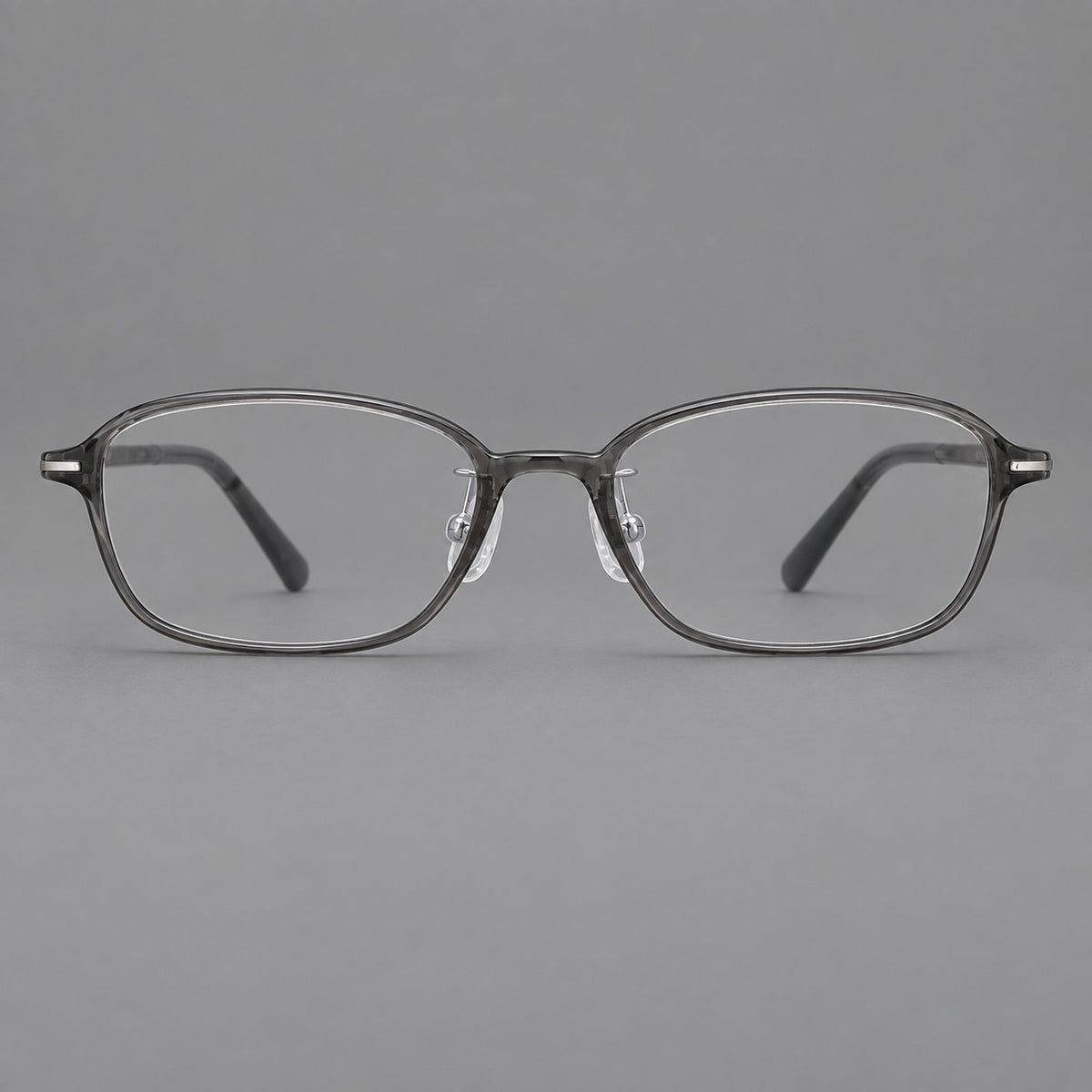 Soft oval plastic eyeglasses with a narrow bridge and gently rounded outer corners in Medium Grey, front view
