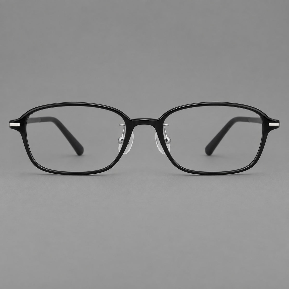 Soft oval plastic eyeglasses with a narrow bridge and gently rounded outer corners in Glossy Black, front view