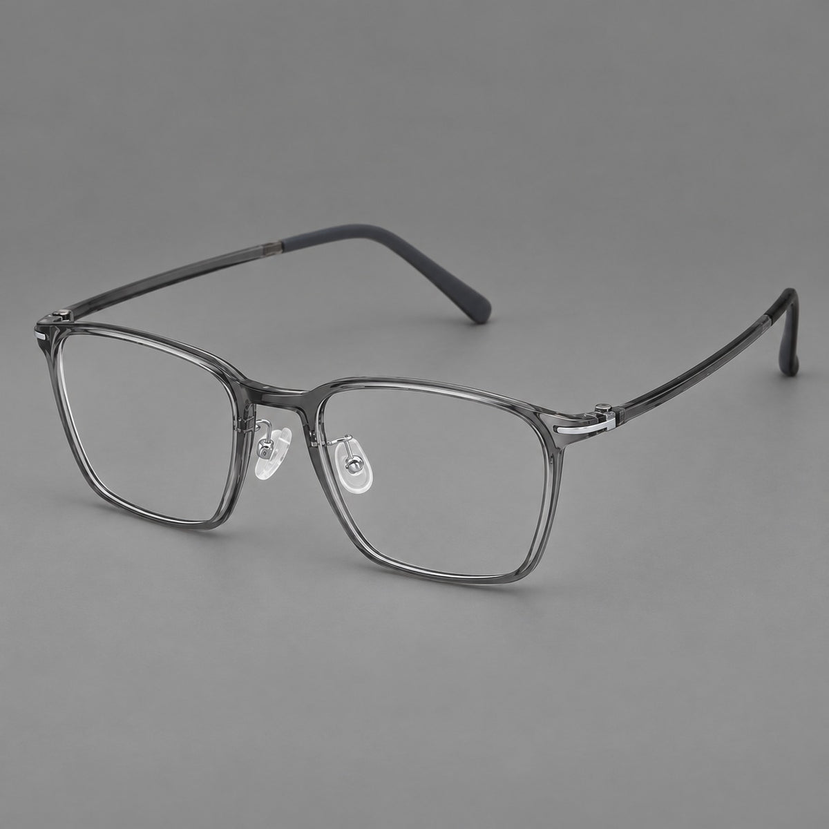 Modern square plastic eyeglasses with a smooth browline and slim metal corner details in Medium Grey, three quarter view