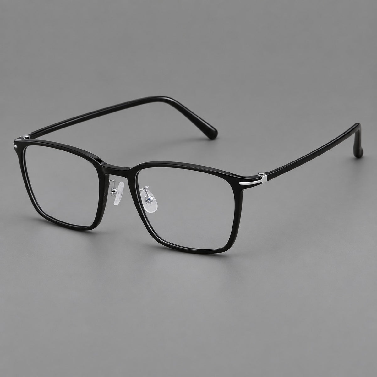 Modern square plastic eyeglasses with a smooth browline and slim metal corner details in Glossy Black, three quarter view