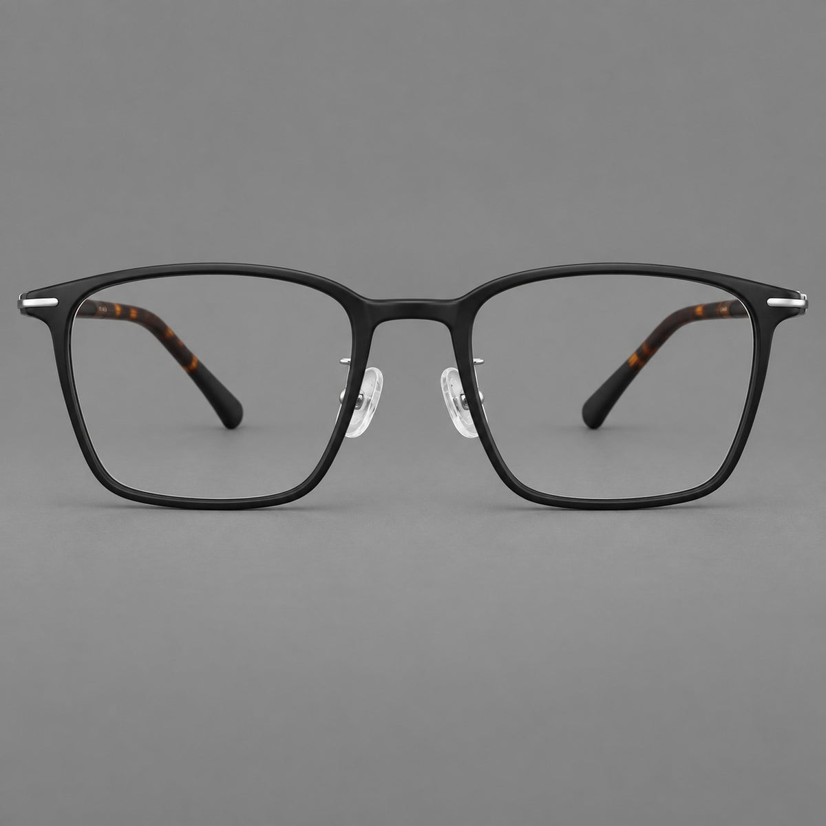 Modern square plastic eyeglasses with a smooth browline and slim metal corner details in Matte Black, front view