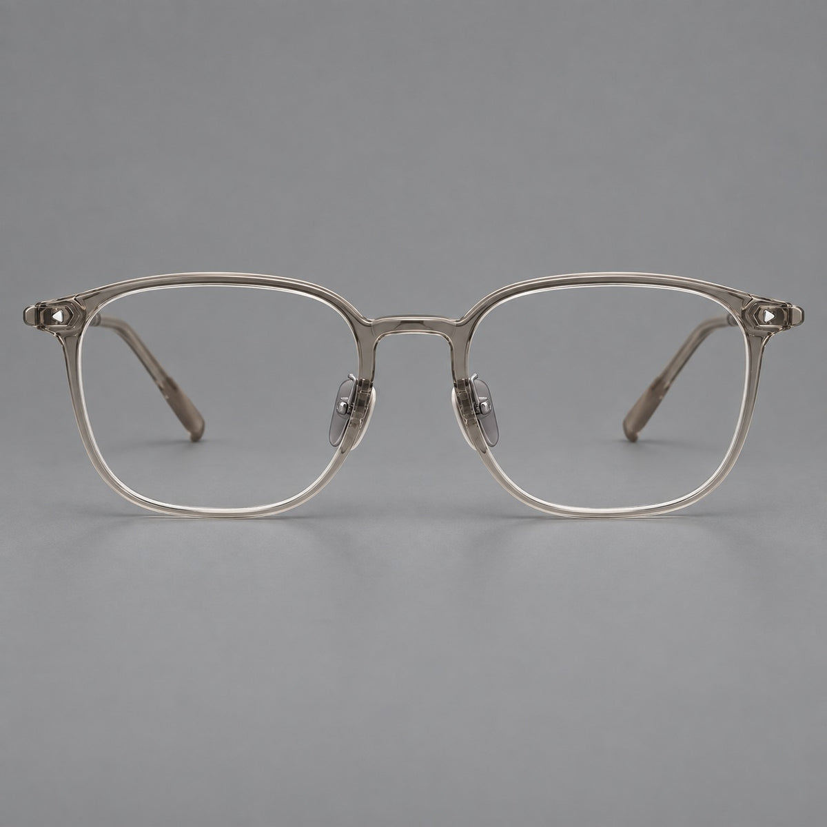 Retro square plastic eyeglasses with a curved bridge and triangular corner details in Grey Tea, front view