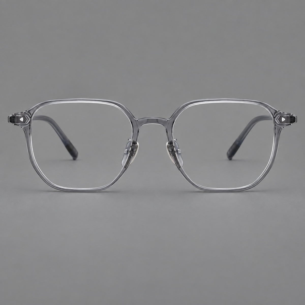 Soft square plastic eyeglasses with rounded lower rims and a broad curved bridge in Ink Grey, front view