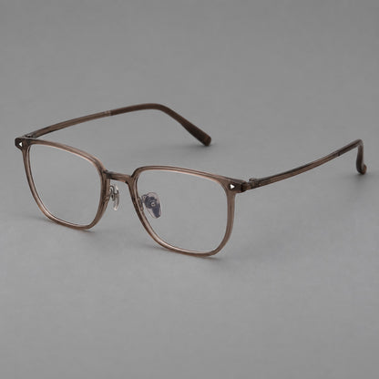 Refined rectangular plastic eyeglasses with raised outer corners and clear nose pads in Brown, three quarter view lens detail
