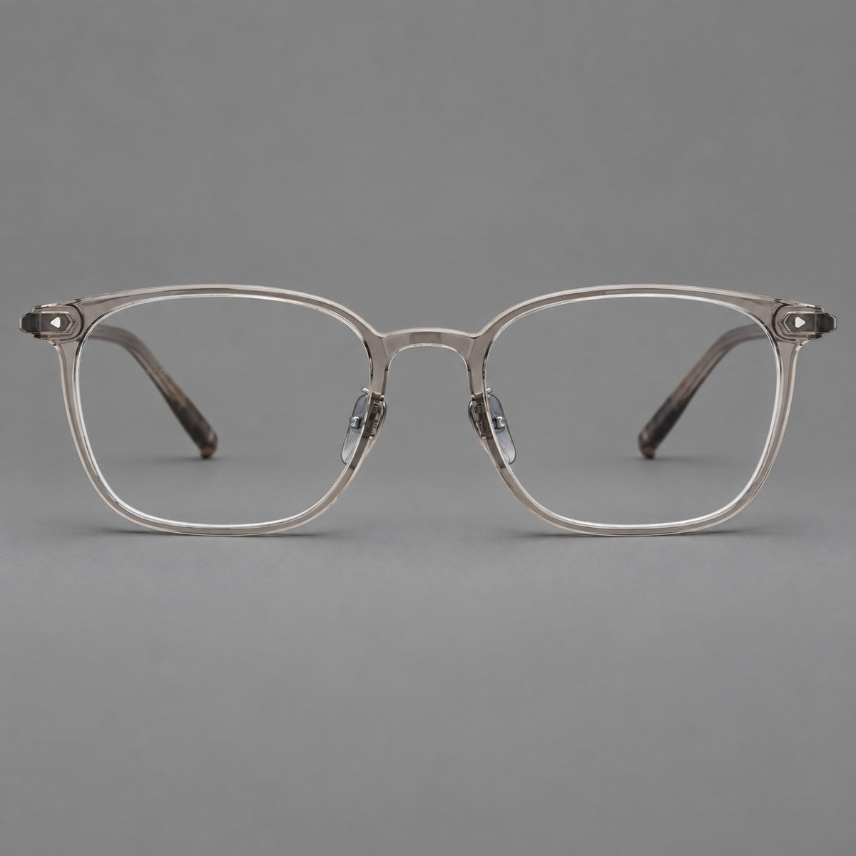 Classic soft square plastic eyeglasses with a gently curved browline and corner studs in Grey Brown, front view