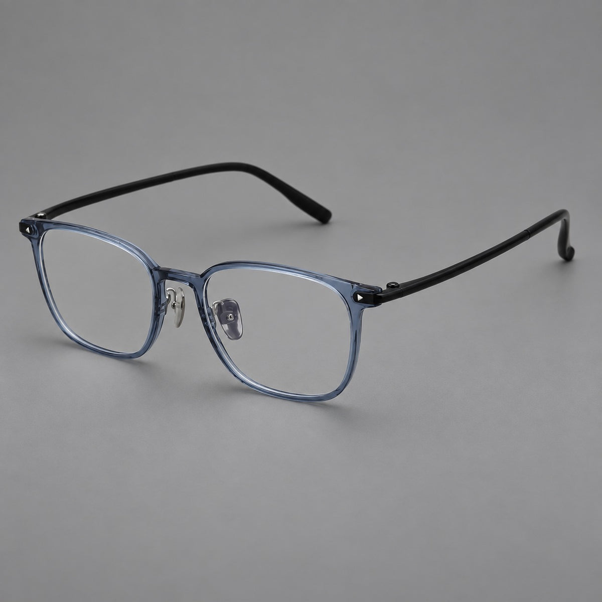 Classic soft square plastic eyeglasses with a gently curved browline and corner studs in Slate Blue, three quarter view