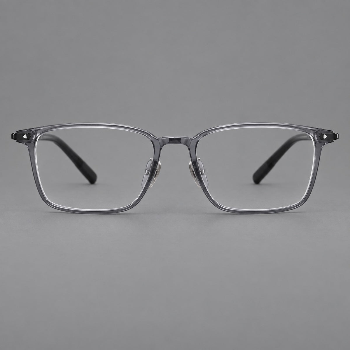 Clean rectangular plastic eyeglasses with flat lower rims and pointed corner details in Ink Grey, front view
