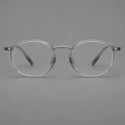 Vintage round plastic eyeglasses with a curved bridge and subtle triangular accents in Light Grey, front view frame detail