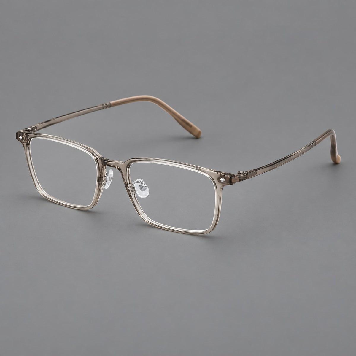 Everyday rectangular plastic eyeglasses with rounded edges and a narrow bridge in Grey Tea, three quarter view