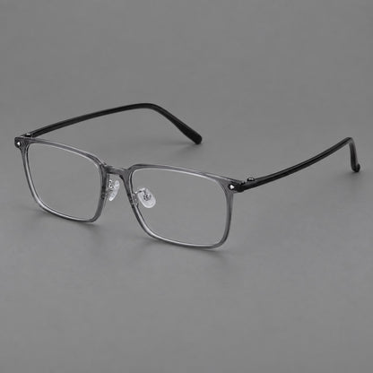 Wide rectangular plastic eyeglasses with an angular browline and slender rims in Medium Grey, three quarter view front view