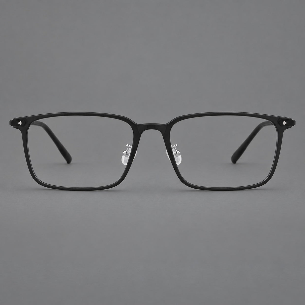 Wide rectangular plastic eyeglasses with an angular browline and slender rims in Matte Black, front view