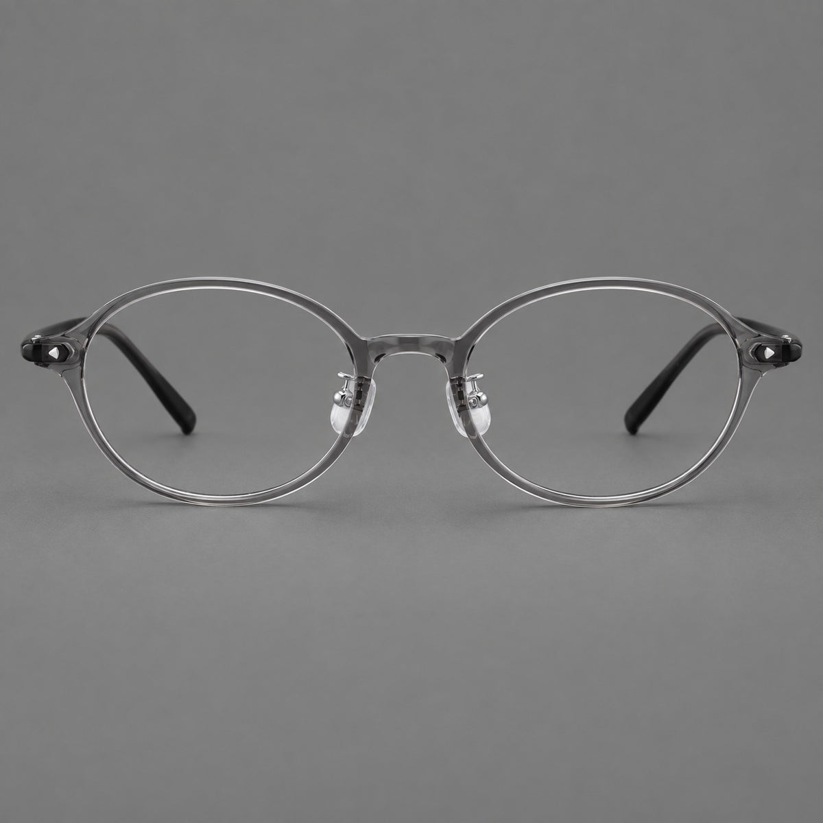 Retro round plastic eyeglasses with softly lifted corners and a sculpted bridge in Grey, front view