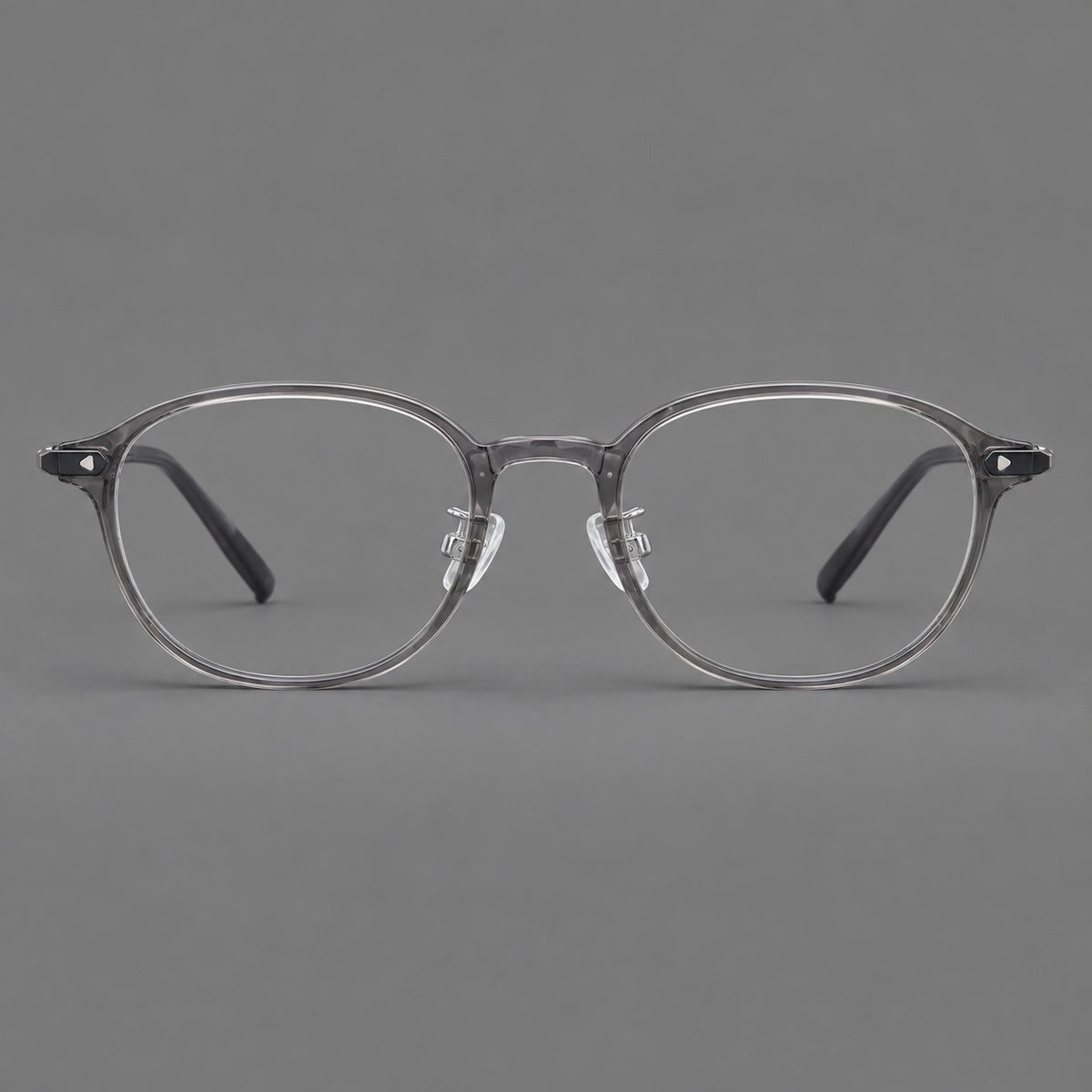 Panto plastic eyeglasses with a rounded silhouette and triangular corner studs in Grey, front view