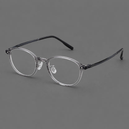 Panto plastic eyeglasses with a rounded silhouette and triangular corner studs in Grey, three quarter view front view
