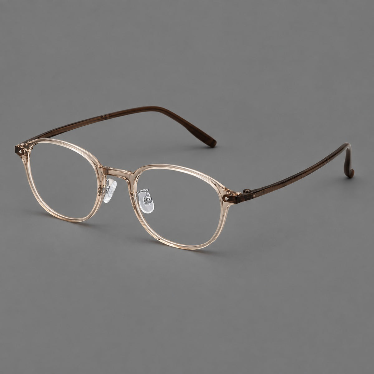 Panto plastic eyeglasses with a rounded silhouette and triangular corner studs in Tea, three quarter view