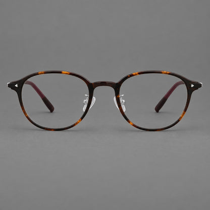 Panto plastic eyeglasses with a rounded silhouette and triangular corner studs in Tortoiseshell, front view additional product view