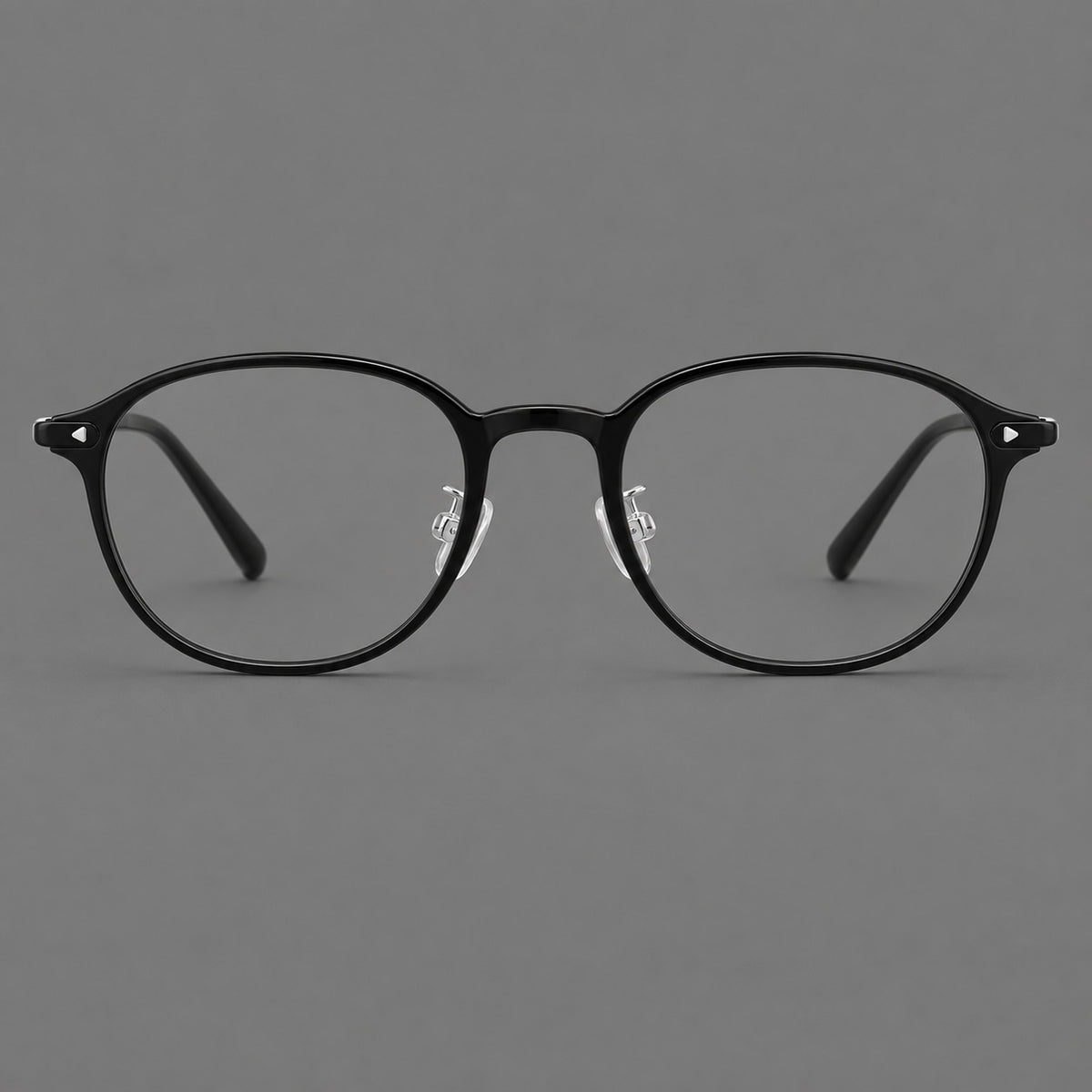Panto plastic eyeglasses with a rounded silhouette and triangular corner studs in Glossy Black, front view
