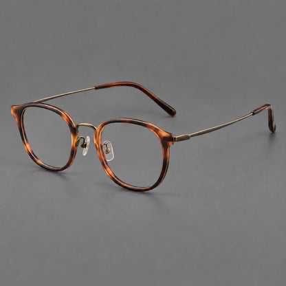 Retro soft square eyeglasses in acetate and titanium with a curved bridge and slender temples in Amber Tortoiseshell / Antique Gold, three quarter view