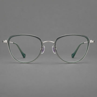 Upswept eyeglasses in acetate and titanium with softly rounded rims and tapered metal temples in Clear Green / Silver, front view side view